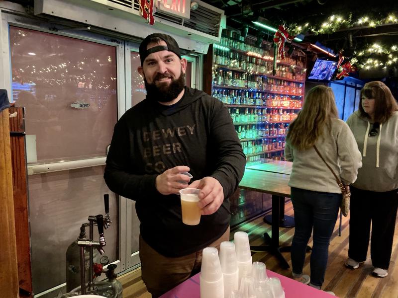 Josh Litten from Dewey Beer Co. keeps the tap flowing.